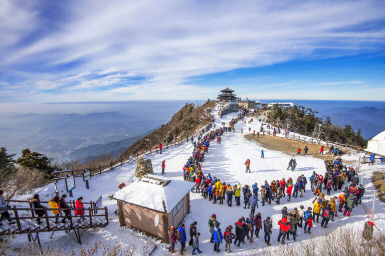 tourists taking photos beautiful scenery skiing around deogyusan